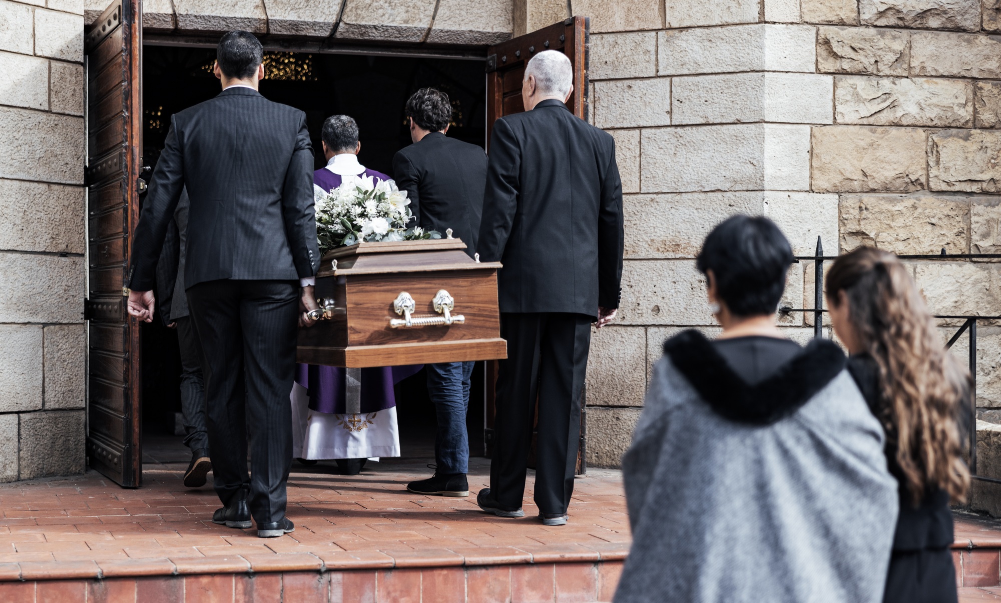 Death, funeral and people with coffin to church, chapel service and ceremony for temple ritual. RIP