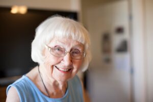 Portrait of senior woman, indoors, smiling